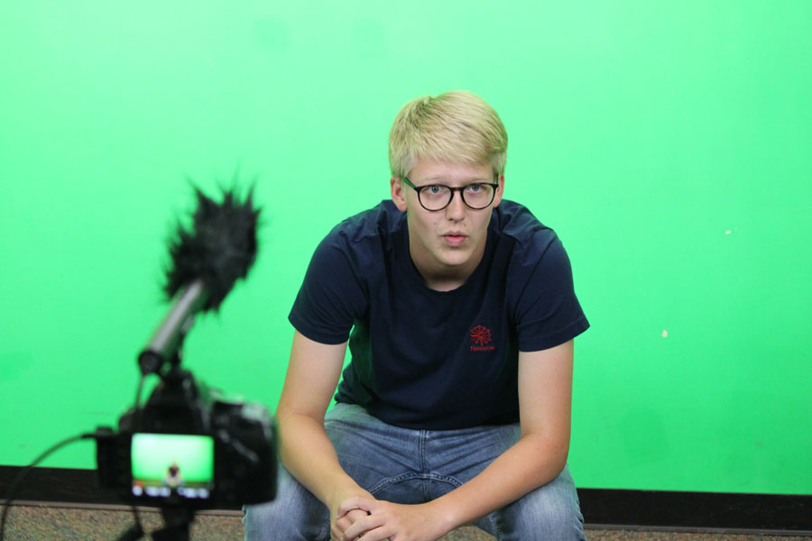 Shaw records a vlog using Miss Marnie Hade’s braodcast room. His video features a big announcement for his fans.