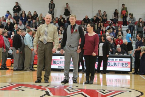 Sophomore Trevor Saye walking with his parents as a member of Snowfest Court 2016.