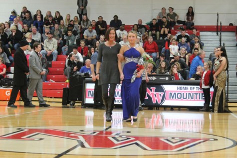 Senior Lexie Savicke walking with her mother as a member of Snowfest Court 2016.