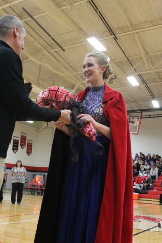 Senior Madison Perrin given flowers after becoming Snowfest Queen.