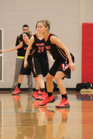 Senior Haley Nugent prepares for East Lansing to make a play.