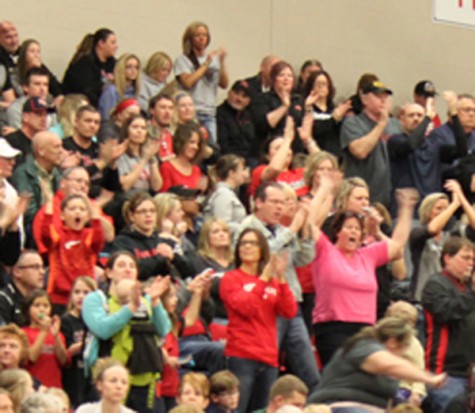 Family and friends cheer on the girls after scoring.