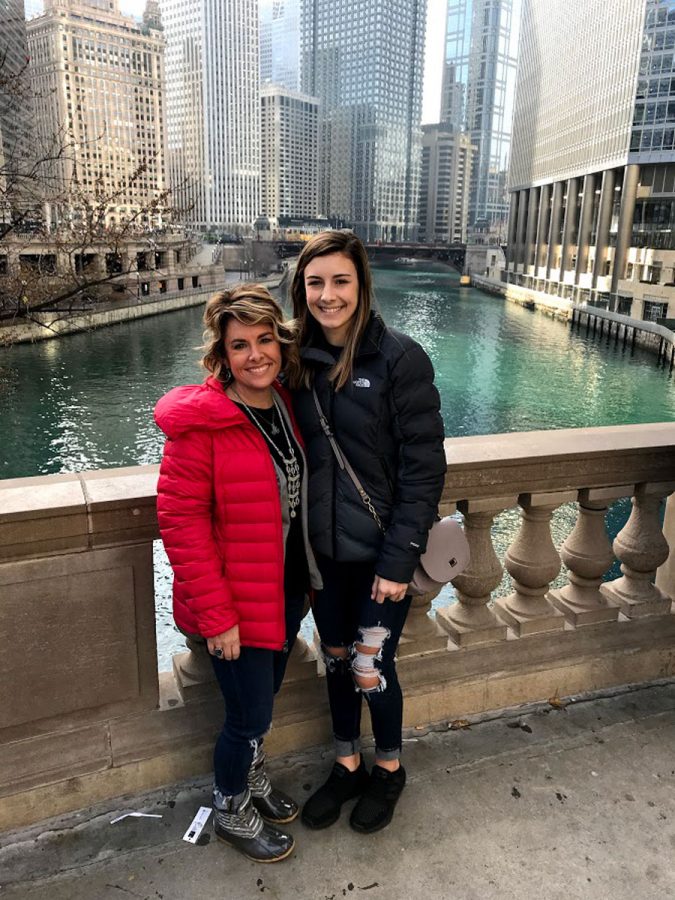 Mrs. Amanda Anspaugh smiles with daughter, Mallory Anspaugh, in front of  the Chicago River as they supported Project Graduation by participating on the trip.