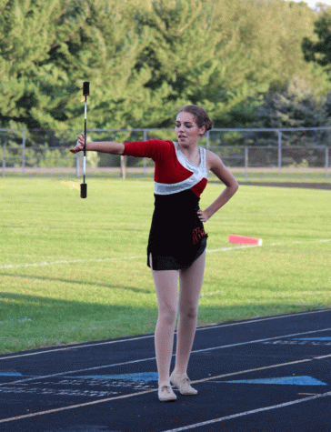 Freshmen Jadyn Sayles  performs during halftime at the homing coming football game.