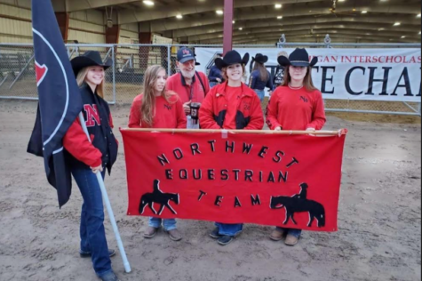 Northwest Equestrian team during opening ceremony at states, in Midland, MI. Team includes (left or right) Kaitlynn Sommer, Skylar Tucker, Coach Dave Cox, Rachel Keeler, Ava Conner