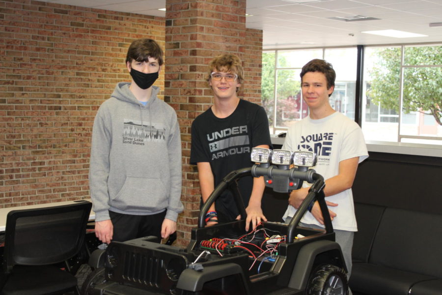 Sophomore students (left to right) Joseph Friend, Evan Hampton, and John Horvath-Frias showing off their latest Jeep. 