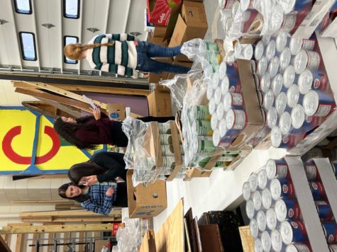 Community members organization and preparing donations for distribution day.
