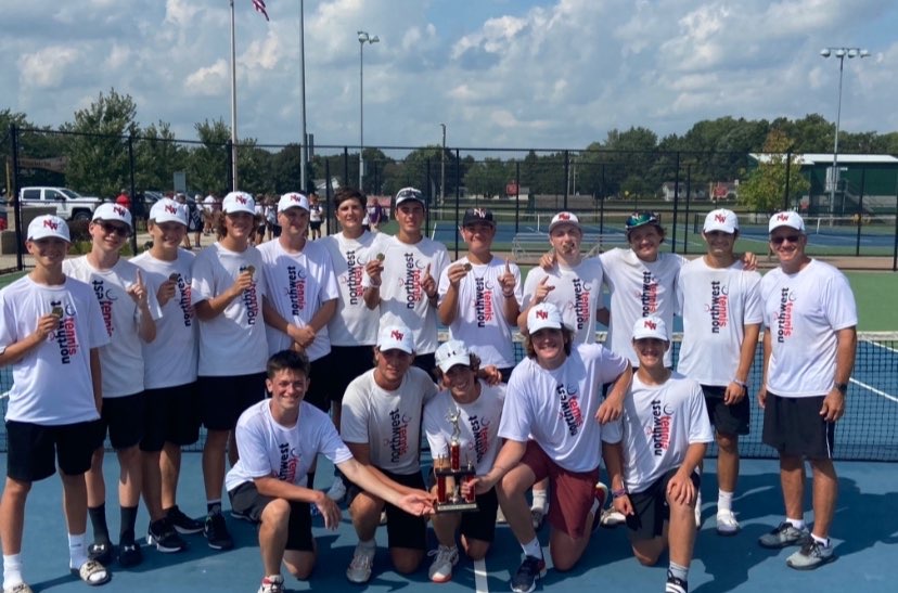 Varsity tennis team celebrates a huge tournament win in Coldwater. 