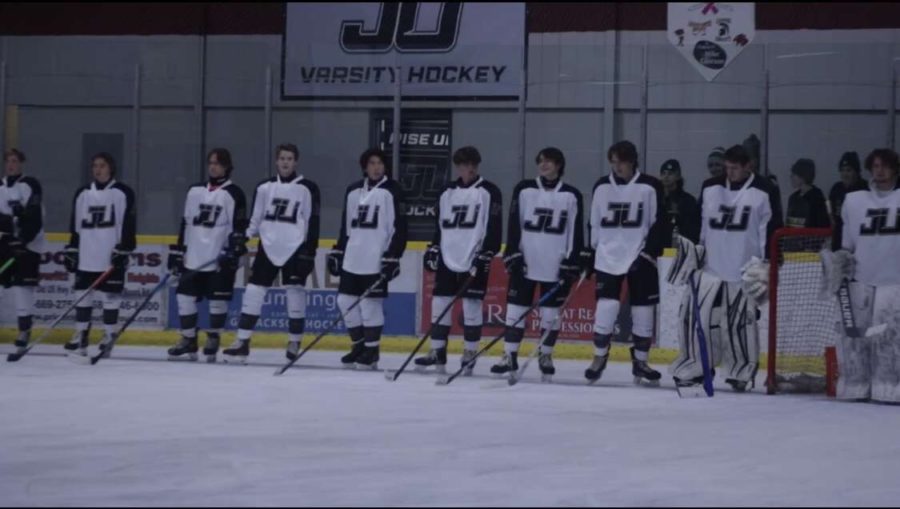 Jackson United Hockey team standing for team introductions, before the start of a game.
