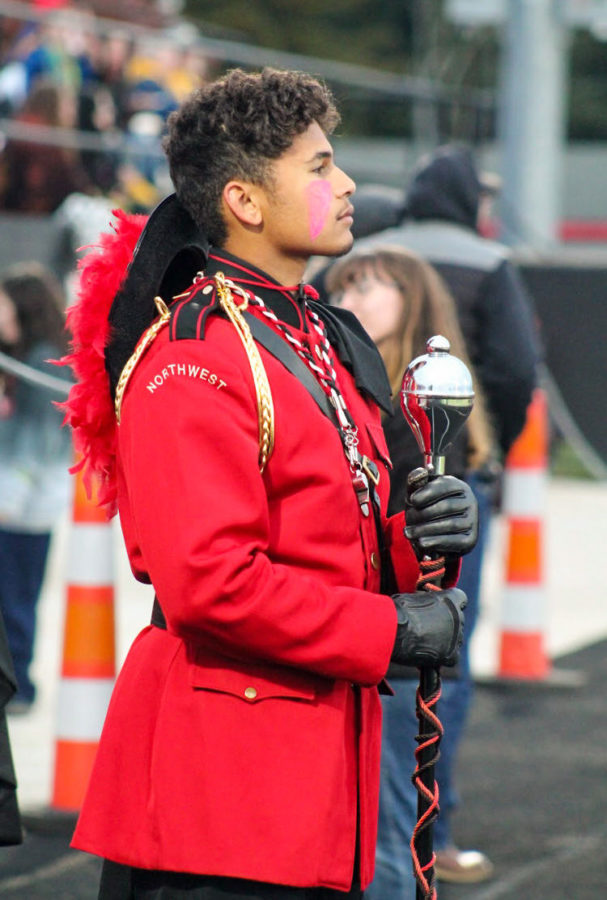 Senior Drum Major Marcus Arbrouet awaits patiently as he and the band will rush onto the field to preform their halftime show. 