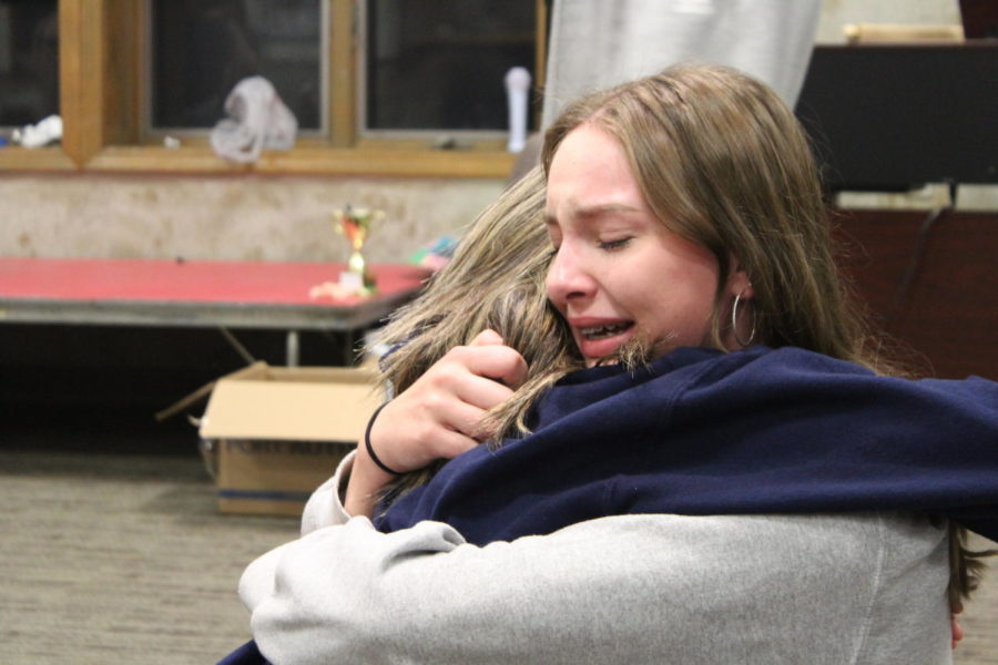 Sophomores Gwen Ebener and Amelia Fracker comfort eachoher after the emotion filled game of Yarn. 