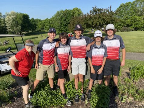 Photo of the boys golf team featuring coach Martha Cantlin.