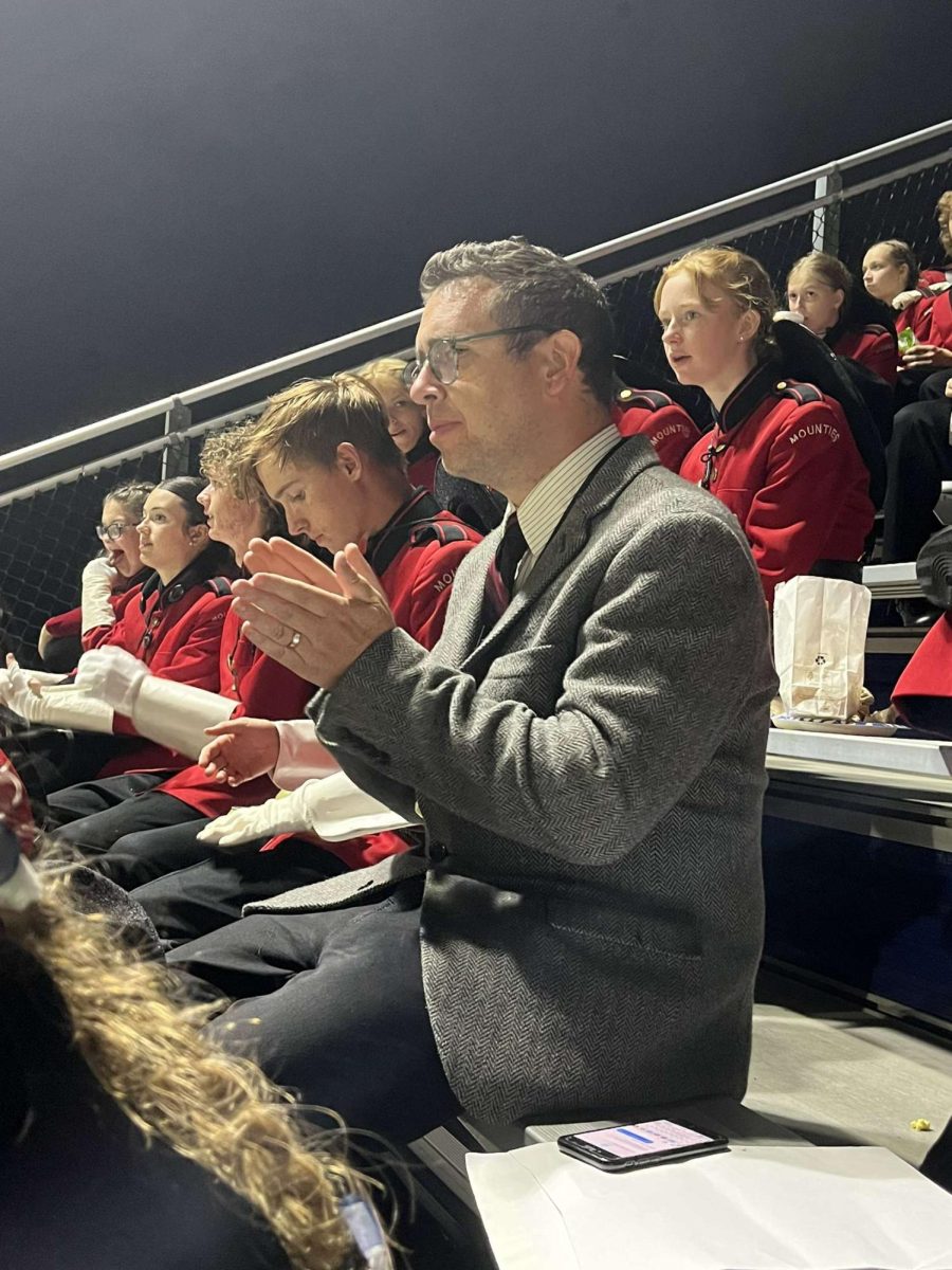 Band Director Bryan Mangiavellano in the stands at the Chelsea Expedition