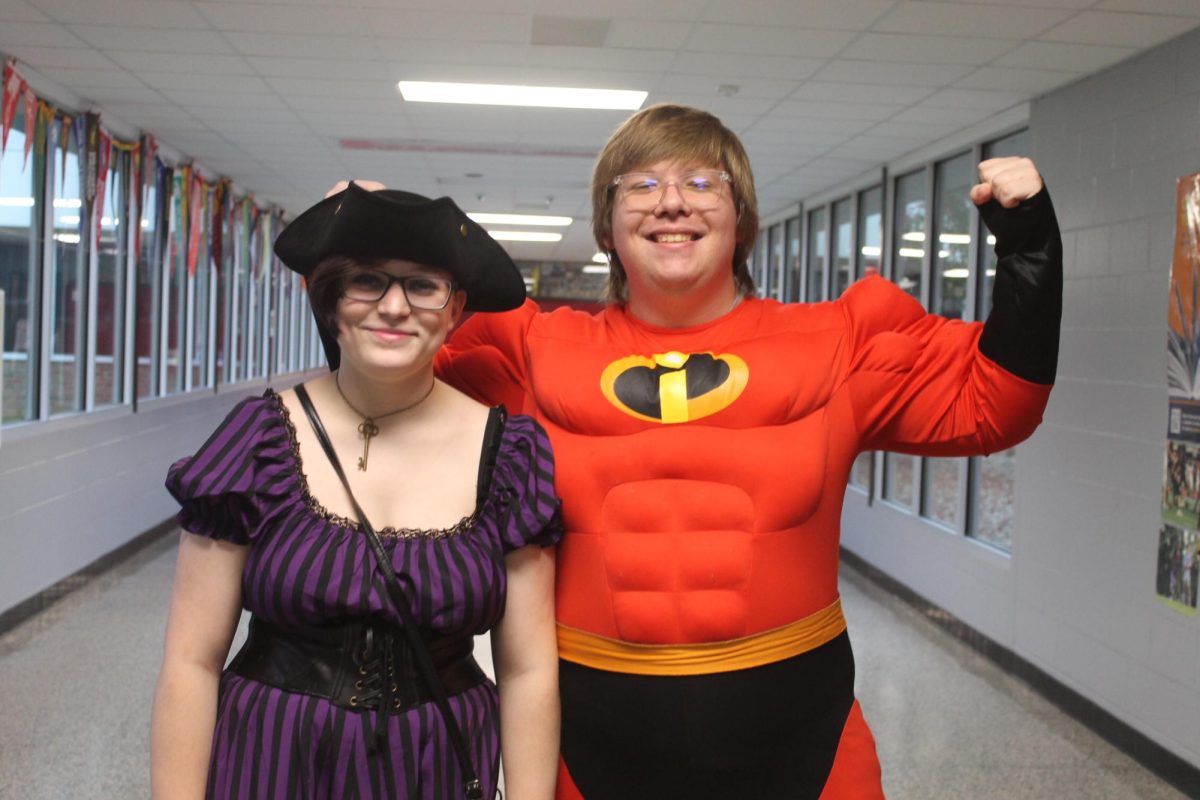 Sky Tyler and Jon Shafor flexing their Halloween costumes.