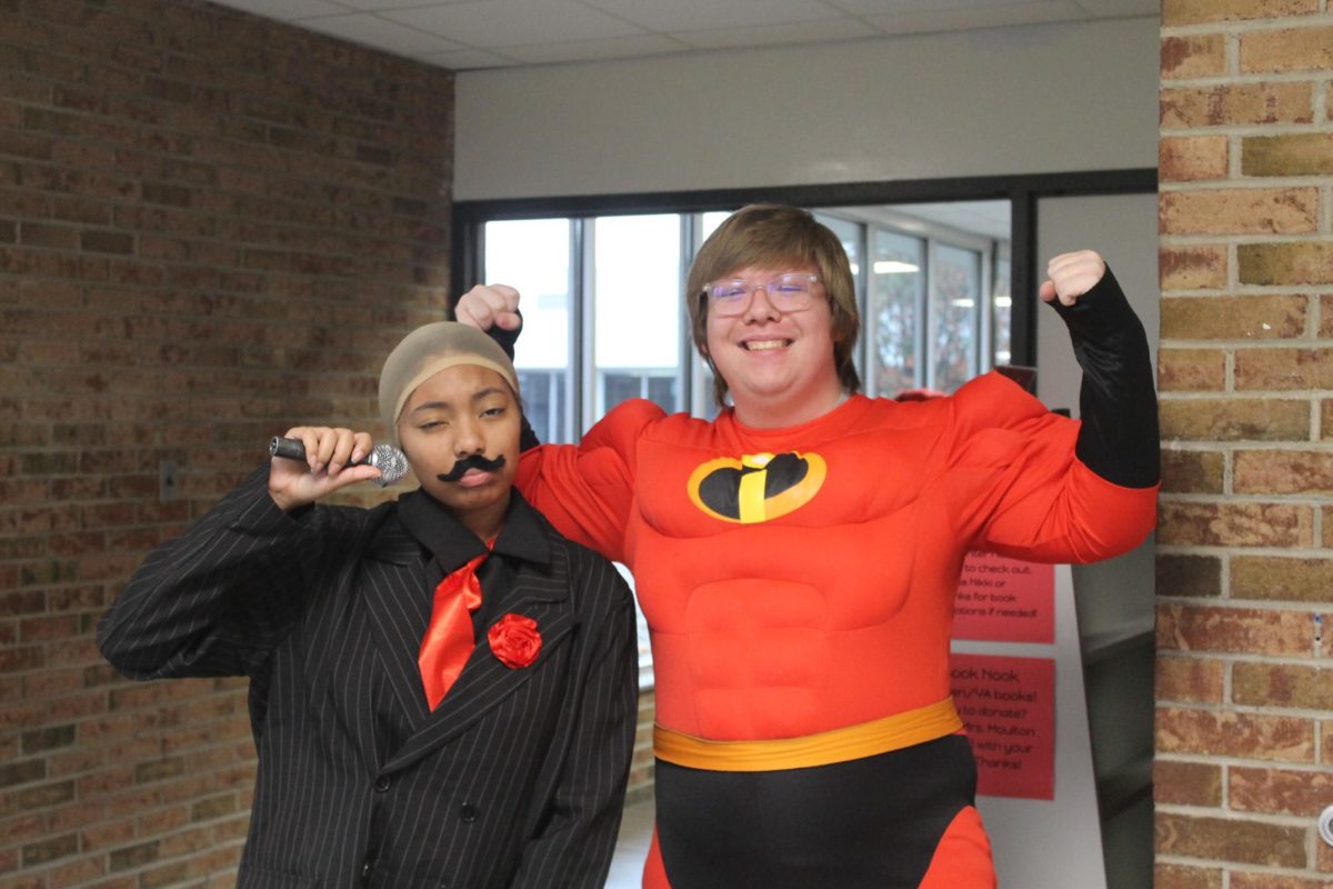 Xandria Taylor and Jon Shafor showing off their costumes.