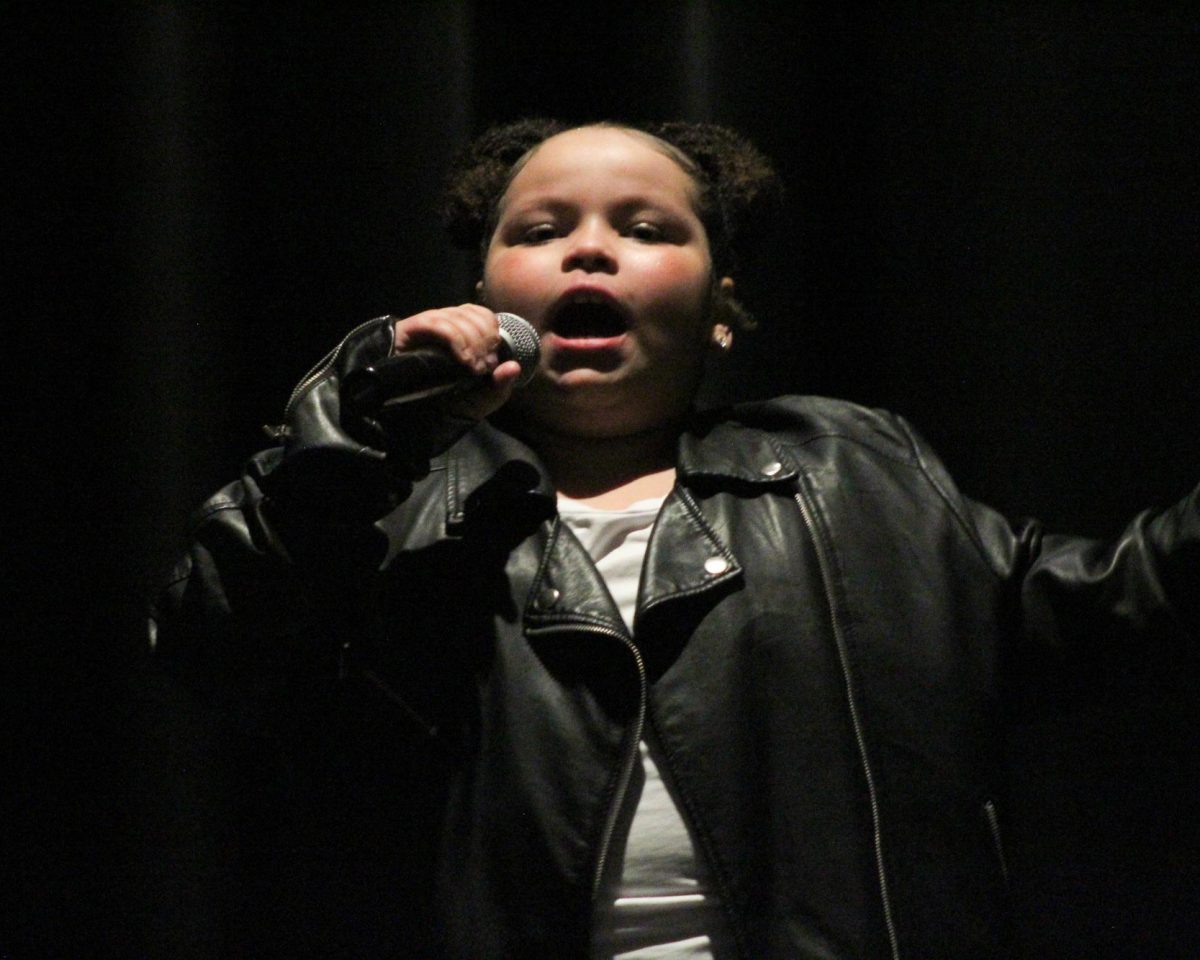 Maya Anderson's singing performance.