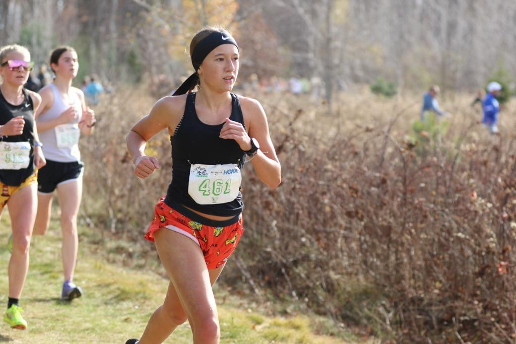 Junior Chloe Khon running at a cross country meet.